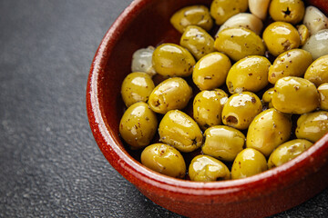 Mediterranean olives with garlic snack aperitif fresh tasty food dish delicious gourmet food...