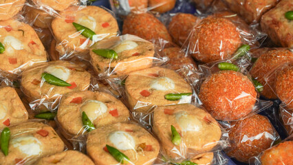 Various javanese traditional snacks or jajanan pasar sold in the market stall. Indonesian food.