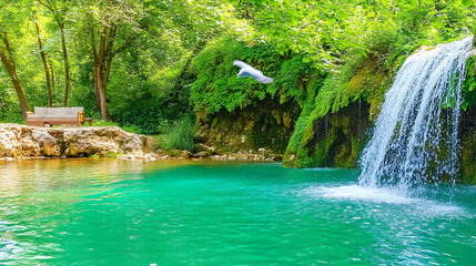 Naklejka premium Serene waterfall cascading into a vibrant turquoise pool, a wooden sofa sits peacefully by the lush green forest, a bird in flight.