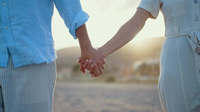 Beautiful happy senior couple dating at the seaside during summertime - Mature married couple in love bonding outdoors at the beach, concepts about elderly lifestyle, relationship and quality of life
