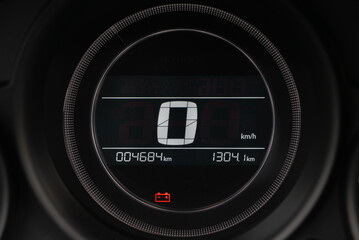 Close up of a car's digital speedometer displaying zero speed Odometer shows mileage