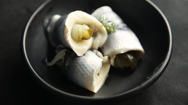 Rollmops herring roll with onion and pickles appetizer fresh tasty food dish delicious gourmet food background on the table rustic food top view copy space vegetarian food pescetarian diet