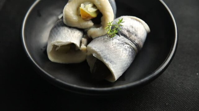 Rollmops herring roll with onion and pickles appetizer fresh tasty food dish delicious gourmet food background on the table rustic food top view copy space vegetarian food pescetarian diet