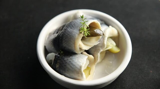 Rollmops herring roll with onion and pickles appetizer fresh tasty food dish delicious gourmet food background on the table rustic food top view copy space vegetarian food pescetarian diet