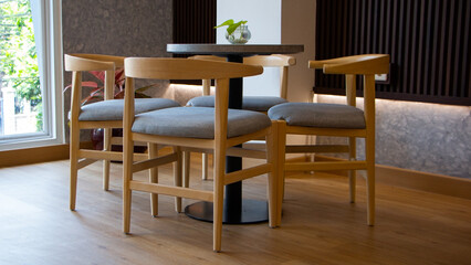 elegant wooden furniture of antique table and chairs in cafe