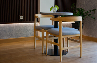 elegant wooden furniture of antique table and chairs in cafe