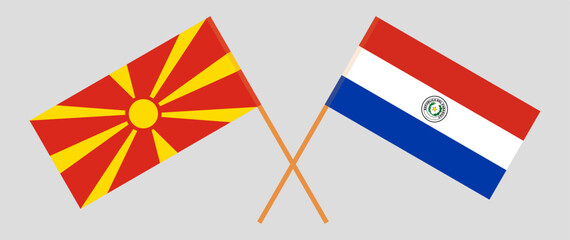 Crossed flags of North Macedonia and Republic of Paraguay. Official colors. Correct proportion. Vector illustration