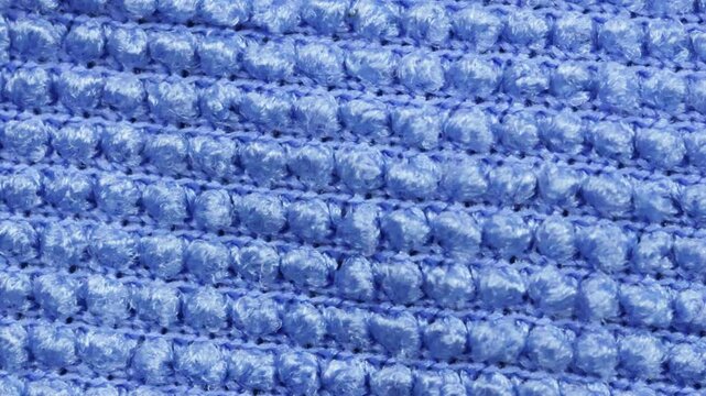 Vue rapproch&eacute;e d'un tissu gaufr&eacute; bleu clair comme arri&egrave;re-plan, texture
