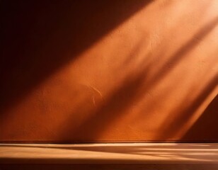 Sunbeams on Rustic Wall: A warm, inviting ray of sunlight streaks across a textured terracotta wall, casting a dramatic shadow and illuminating a wooden baseboard.