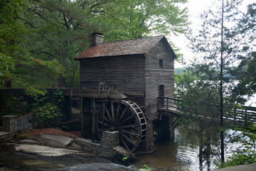 Old grist mill with a water wheel © Allen Penton