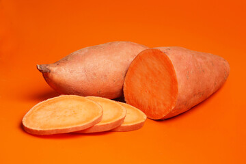 sweet potato yam on orange background