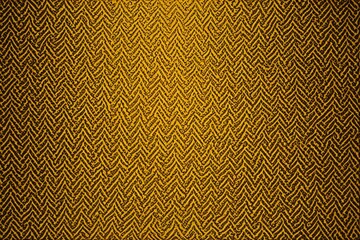 Fototapeta premium a close up of a yellow and black wall with a pattern
