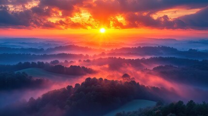 Obraz premium Vibrant Sunrise Over Misty Rolling Hills and Forests