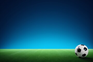 Naklejka premium arafed soccer ball on a green field with a blue sky in the background