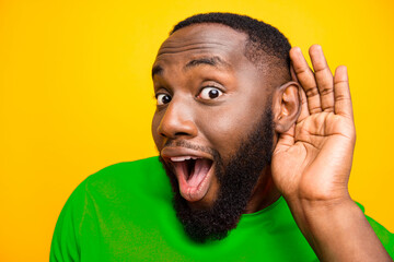 Close up photo of listening overhearing eavesdropping black willing information to be leaked while...