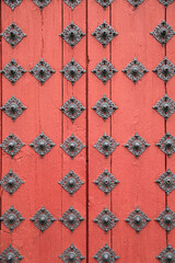 red door of the historic Cathedral of Salamanca, Spain