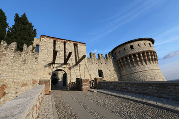 ruins of historic castle of Brescia at sunset, Italy
