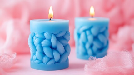 Blue candle with braided texture on pink background
