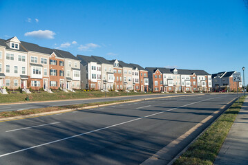 Multi-family homes in a large community. Modern bricks townhouse