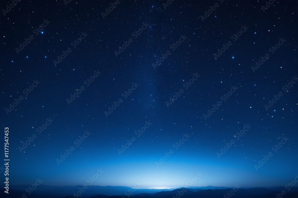 Wall mural starry sky with a bright light shining over a mountain range