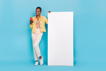 Full length body size view of beautiful trendy cheery girl using device copy space promo isolated...