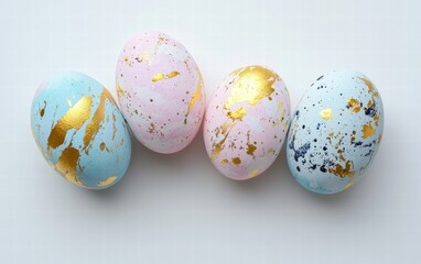 Fototapeta premium Subtly textured pastel eggs with golden details on a bright white background