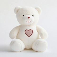 A single white teddy bear with a heart emblem embroidered on its chest placed on white