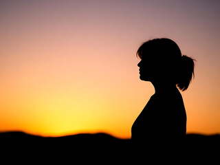 silhouette of a woman with a backpack