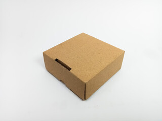 small brown cardboard box isolated on white background, forming a square cube, suitable as a place for various small packages such as elegant and charming gifts, for product catalog design