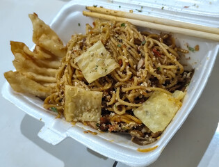 Mie Gacoan, Fried Noodles with Popular Indonesian Spicy Level, served with Fried Dumplings and...