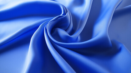 This image showcases a smooth, elegant blue silk fabric, beautifully draped, highlighting its luxurious texture and the play of light upon its surface.