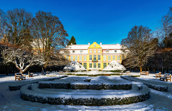 Lawns and architecture in winter Oliwa Park in Gdansk, ancient abby garden	