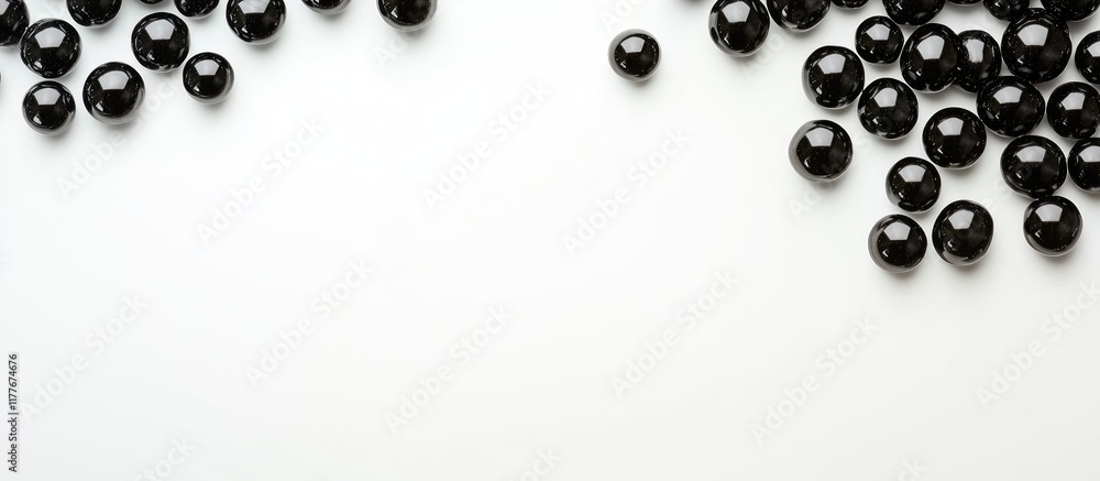 Poster black glossy beads arranged on a white background with ample blank space for text or design elements