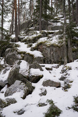 A rugged, snowy mountain path leading to the Struve Geodetic Arc. Ideal for articles or advertisements on winter trekking, historical exploration, or UNESCO World Heritage Sites.