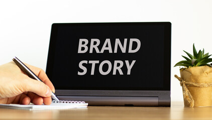 Brand story branding symbol. Concept words Brand story on beautiful black tablet. Beautiful white...