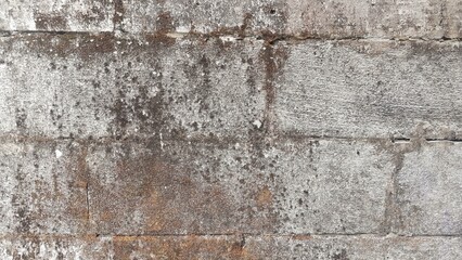 The surface motif of an old and worn house wall