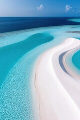 Fototapeta premium Serene turquoise waters and white sand curves in a tropical paradise at midday