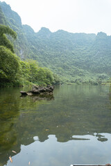 Fototapeta premium Ninh Binh, Vietnam. Reflections on a River