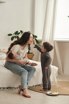 son gives mom a banana to taste