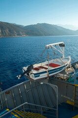 White and blue  lifeboat aboard the ferry ship in sunny day in Greece