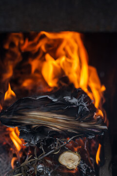 Burning Paper and Firewood in Flames
