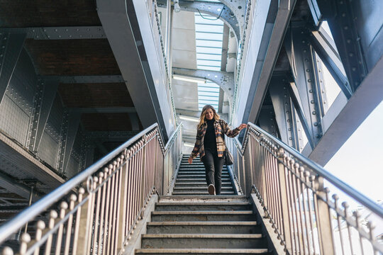 Woman Walking Down Outdoor Stairs