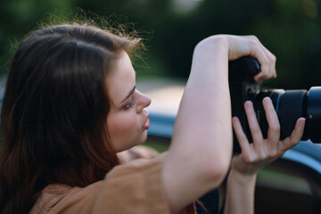 Young photographer focused on capturing images outdoors, showcasing creativity, passion for...