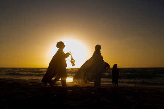 Friends Passing Around Ramadan Lantern on Eid