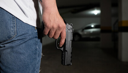 man carrying a gun down