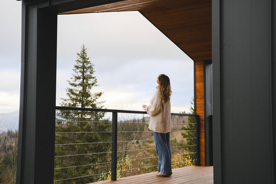Young girl in early morning on terrace.
