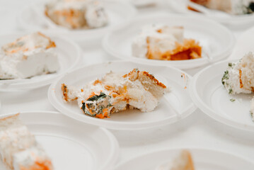 pieces of cake on plastic disposable plates, treat for large company