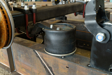 Mechanical suspension system showcasing air spring components in detail