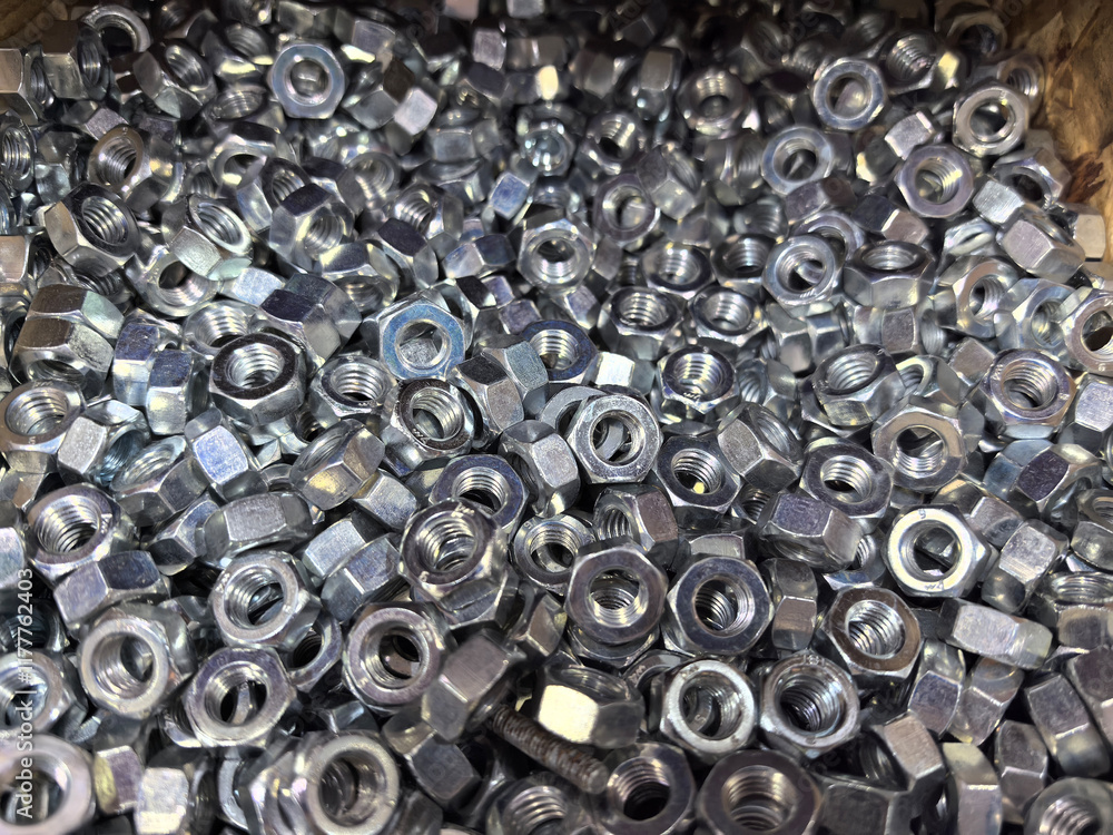 Aufkleber assortment of shiny metal nuts in a workshop ready for assembly tasks