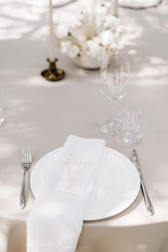 Elegant wedding table setting with floral decorations and candles
